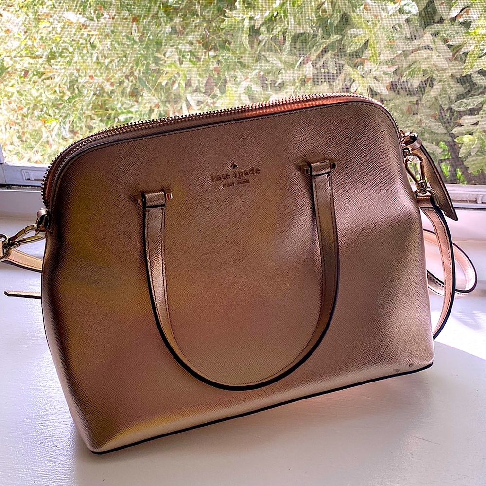 New, without tags gold satchel Kate Spade bag. In excellent condition.